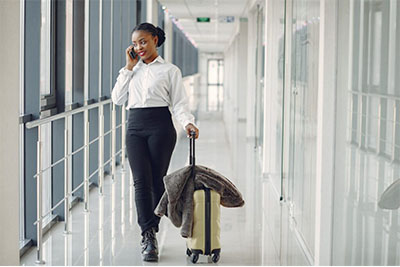 black woman with suitcase airport 1157 33370 1024x682
